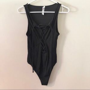 Free People low cut lace up body suit. NWOT.